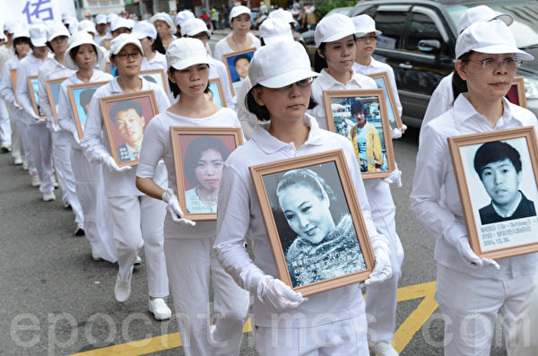 2012年7月21日，台灣法輪功學員於台中市舉行720反迫害遊行。（攝影：蘇玉芬／大紀元）
