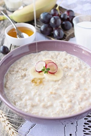 Oatmeal porridge with grapes,banana and honey
