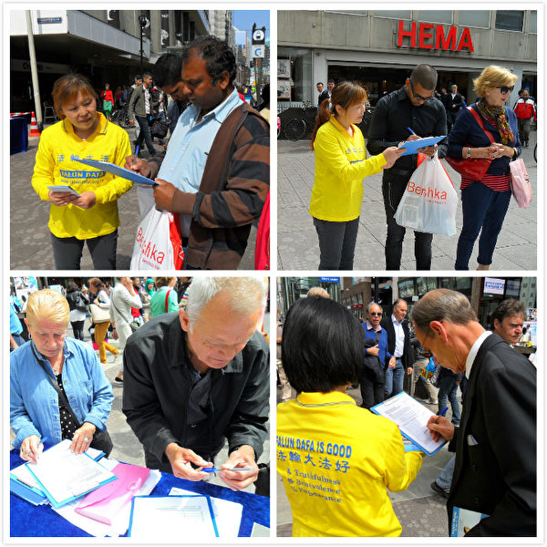 荷蘭法輪功學員來到行政首都海牙市，在商業區講真相徵簽名。（明慧網）