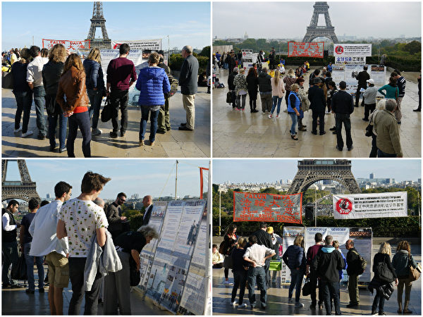 1：部分巴黎法轮功学员在人权广场举行真相活动，图为人们围着法轮功的信息台了解真相。（明慧网）