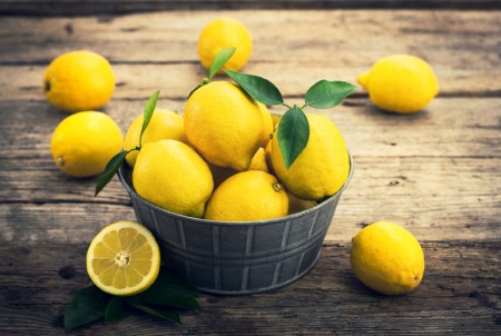 Fresh lemons on the rustic tale