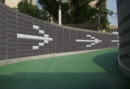 橡膠再生的綠板材，用於車道壁材，有助行車安全。 ( 泰陽橡膠 提供)