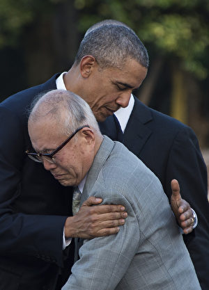 US President Barack Obama hugs Shigeaki Mori, a survivor of the 1945 atomic bombing of Hiroshima, during a visit to the Hiroshima Peace Memorial Park on May 27, 2016. Obama on May 27 paid moving tribute to victims of the world's first nuclear attack. / AFP / JIM WATSON (Photo credit should read JIM WATSON/AFP/Getty Images)