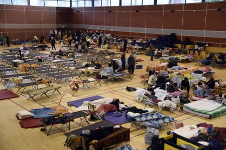 People wait in a gymnasium of Nemours,some 80km south of Paris, following their evacuation after the Loing river burst its banks causing flood on June 2, 2016. Heavy rains lashing parts of France, Germany and Austria cut roads, stranded people on rooftops and forced schools to close their doors, and French weather forecasters warned of more to come on June 2. Three people who had been trapped in a house at Simbach am Inn in southern Germany were found dead, local authorities said, and police warned several other people could be on the ground floor of the building. AFP PHOTO / DOMINIQUE FAGET / AFP / DOMINIQUE FAGET (Photo credit should read DOMINIQUE FAGET/AFP/Getty Images)