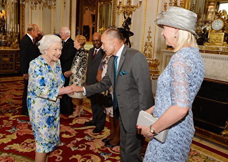 Britain's Queen Elizabeth II (R) shakes hands with New Zealand's Governor-General Jerry Mateparae (2R) during a reception ahead of the Governor General's lunch in honour of the Queen's 90th birthday at Buckingham Palace in London on June 10, 2016. Britain started a weekend of events to celebrate the Queen's 90th birthday. The Queen and the Duke of Edinburgh along with other members of the royal family will attend a national service of thanksgiving at St Paul's Cathedral on June 10, which is also the Duke of Edinburgh's 95th birthday. / AFP / POOL / John Stillwell (Photo credit should read JOHN STILLWELL/AFP/Getty Images)