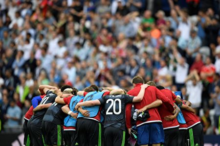 Wales' players stand together after the Euro 2016 group B football match between England and Wales at the Bollaert-Delelis stadium in Lens on June 16, 2016. England won the match 2-1. / AFP / MARTIN BUREAU (Photo credit should read MARTIN BUREAU/AFP/Getty Images)