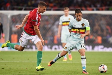 Belgium's forward Eden Hazard (R) vies Hungary's forward Adam Szalai during the Euro 2016 round of 16 football match between Hungary and Belgium at the Stadium Municipal in Toulouse on June 26, 2016. / AFP / PASCAL GUYOT (Photo credit should read PASCAL GUYOT/AFP/Getty Images)