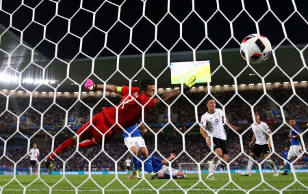 BORDEAUX, FRANCE - JULY 02: Gianluigi Buffon of Italy dives in vain as Mesut Oezil of Germany scores the oepning goal during the UEFA EURO 2016 quarter final match between Germany and Italy at Stade Matmut Atlantique on July 2, 2016 in Bordeaux, France. (Photo by Alex Livesey/Getty Images)