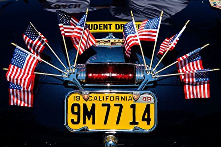 American flags decorate a California license plate during the 4th of July Parade in Alameda, California on Monday, July 4, 2016. / AFP / GABRIELLE LURIE (Photo credit should read GABRIELLE LURIE/AFP/Getty Images)