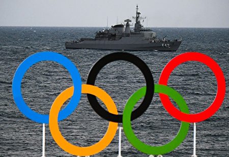 A boat of the Navy of Brazil is pictured with the Olympic Rings in the foreground as she patrols the coast of Copacabana beach, in Rio de Janeiro, on August 4, 2016, ahead of the Rio 2016 Olympic Games. / AFP / LUIS ACOSTA (Photo credit should read LUIS ACOSTA/AFP/Getty Images)