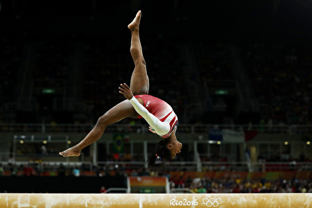 RIO DE JANEIRO, BRAZIL - AUGUST 09: Simone Biles of the United States competes on the balance beam during the Artistic Gymnastics Women's Team Final on Day 4 of the Rio 2016 Olympic Games at the Rio Olympic Arena on August 9, 2016 in Rio de Janeiro, Brazil. (Photo by Lars Baron/Getty Images)