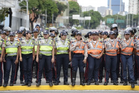 Venezuelan police face demonstrators before an opposition march in Caracas, on September 1, 2016. Venezuela's opposition and government head into a crucial test of strength Thursday with massive marches for and against a referendum to recall President Nicolas Maduro that have raised fears of a violent confrontation. / AFP / FEDERICO PARRA (Photo credit should read FEDERICO PARRA/AFP/Getty Images)