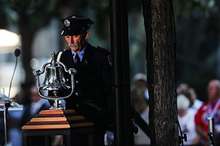 NEW YORK, NY - SEPTEMBER 11: A firefighter rings a bell as family members, emergency workers and others attend a commemoration ceremony for the victims of the September 11 terrorist attacks at the National September 11 Memorial and Museum fifteen years after the day on September 11, 2016 in New York City. Throughout the country services are being held to remember the 2,977 people who were killed in New York, the Pentagon and in a field in rural Pennsylvania. (Photo by Spencer Platt/Getty Images)