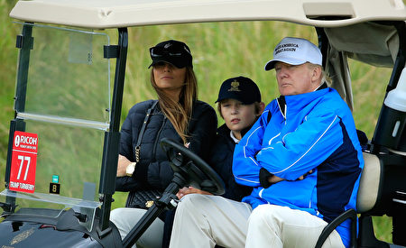 TURNBERRY, SCOTLAND - AUGUST 01: Donald Trump watches the action with wife Melania and son Barron during the Third Round of the Ricoh Women's British Open at Turnberry Golf Club on August 1, 2015 in Turnberry, Scotland. (Photo by David Cannon/Getty Images)