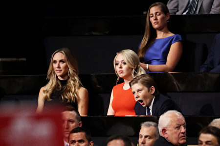 CLEVELAND, OH - JULY 21: Lara Yunaska, Tiffany Trump and Barron Trump listen to Ivanka Trump speak during the evening session on the fourth day of the Republican National Convention on July 21, 2016 at the Quicken Loans Arena in Cleveland, Ohio. Republican presidential candidate Donald Trump received the number of votes needed to secure the party's nomination. An estimated 50,000 people are expected in Cleveland, including hundreds of protesters and members of the media. The four-day Republican National Convention kicked off on July 18. (Photo by Win McNamee/Getty Images)