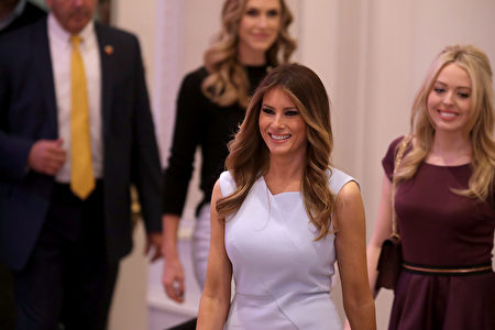 WASHINGTON, DC - OCTOBER 26: Melania Trump (C), wife of Republican presidential nominee Donald Trump, arrives for the grand opening ceremony at the new Trump International Hotel October 26, 2016 in Washington, DC. The hotel, built inside the historic Old Post Office, has 263 luxury rooms, including the 6,300-square-foot 'Trump Townhouse' at $100,000 a night, with a five-night minimum. The Trump Organization was granted a 60-year lease to the historic building by the federal government before the billionaire New York real estate mogul announced his intent to run for president. (Photo by Chip Somodevilla/Getty Images)