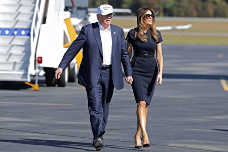WILMINGTON, NC - NOVEMBER 05: Republican presidential nominee Donald Trump (L) and his wife Melania Trump arrive for a campaign rally the Air Wilmington Hangar located at Wilmington International Airport November 5, 2016 in Wilmington, North Carolina. With less than a week before Election Day in the United States, Trump and his opponent, Democratic presidential nominee Hillary Clinton, are campaigning in key battleground states that each must win to take the White House. (Photo by Chip Somodevilla/Getty Images)