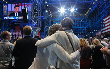 Supporters of Democratic presidential nominee Hillary Clinton react during election night at the Jacob K. Javits Convention Center in New York on November 8, 2016. / AFP / Kena Betancur (Photo credit should read KENA BETANCUR/AFP/Getty Images)