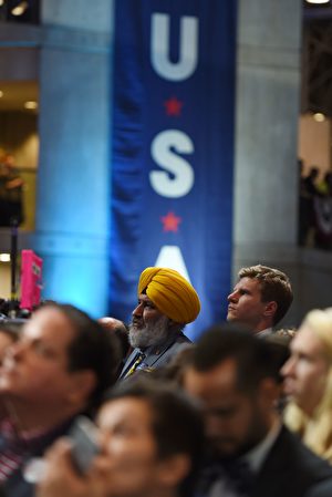 People watch elections results during election night at the Jacob K. Javits Convention Center in New York on November 8, 2016. US Democratic presidential nominee Hillary Clinton will hold her election night event at the convention center. / AFP / DON EMMERT (Photo credit should read DON EMMERT/AFP/Getty Images)