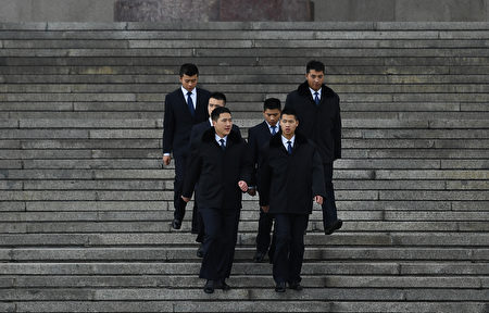 Security personnel walk down the steps of the Great Hall of the People in Beijing on November 7, 2016. China effectively barred two elected pro-independence lawmakers from Hong Kong's legislature on November 7 after they deliberately misread their oaths, saying that they could not be sworn in again. An oath that did not conform to Hong Kong's law "should be determined to be invalid, and cannot be retaken", the Communist-controlled National People's Congress (NPC) in Beijing said in a rare interpretation of the semi-autonomous city's constitution. / AFP / GREG BAKER (Photo credit should read GREG BAKER/AFP/Getty Images)