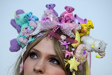 LONDON, ENGLAND - NOVEMBER 25: A woman who gave her name as 'Aerith' poses for a photograph in her cosplay outift as she visits the Hyper Japan Christmas Market on November 25, 2016 in London, England. The market showcases Japanese popular culture and runs from 25 to 27 November. (Photo by Carl Court/Getty Images)