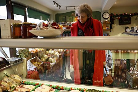 MAIDENHEAD, ENGLAND - DECEMBER 02: Britain's Prime Minister Theresa May visits a local butchers shop in her constituency of Maidenhead ahead of Small Business Saturday on December 02, 2016 in Maidenhead, England. (Photo by Stefan Wermuth - Pool / Getty Images)