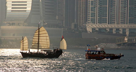 A modern junks (R) salis past a traditional junk in Hong Kong on March 14, 2011. A junk is an ancient Chinese sailing vessel design still in use today. Junks were developed during the Han Dynasty (206 BC220 AD) and were used as sea-going vessels as early as the 2nd century AD. AFP PHOTO / LAURENT FIEVET (Photo credit should read LAURENT FIEVET/AFP/Getty Images)
