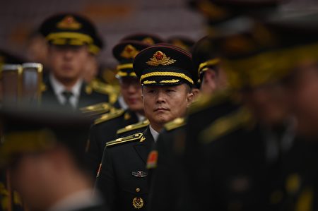Members of a military band arrive for the closing session of the Chinese People's Political Consultative Conference (CPPCC) at the Great Hall of the People in Beijing on March 14, 2016. The CPPCC, a discussion body that is part of the Communist Party-controlled governmental structure, closed on March 14 after its 12-day annual session. / AFP / GREG BAKER (Photo credit should read GREG BAKER/AFP/Getty Images)