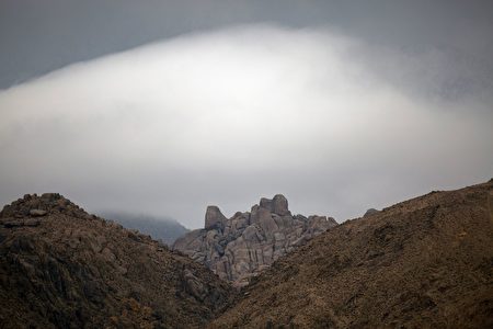 Misty clouds move through the desert near Lone Pine, California, January 8, 2017 as a series of strong storms moves into California. Californians braced for a series of major storms expected to hit the western state, bringing mudslides and power outages, but also much hoped-for relief from a six-year drought. Meteorologists said the storms, set to drench Northern California through part of next week, could be the heaviest in a decade. The stormy weather, described as a type of system called atmospheric rivers, come as the parched Golden State is experiencing its wettest winter in years. / AFP / DAVID MCNEW (Photo credit should read DAVID MCNEW/AFP/Getty Images)