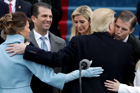 WASHINGTON, DC - JANUARY 20: President Donald Trump kisses his son Eric Trump after his inauguration on the West Front of the U.S. Capitol on January 20, 2017 in Washington, DC. In today's inauguration ceremony Donald J. Trump becomes the 45th president of the United States. (Photo by Alex Wong/Getty Images)
