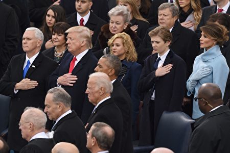 US Vice President Mike Pence, US President Donald Trump his wife Melania (R) and son Barron (2nd R) pray during the swearing-in ceremony as 45th President of the USA in front of the Capitol in Washington on January 20, 2017. / AFP / Timothy A. CLARY (Photo credit should read TIMOTHY A. CLARY/AFP/Getty Images)