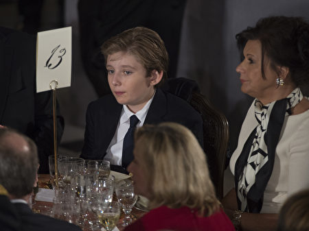 President Donald Trump's son Barron Trump attends the Inaugural Luncheon in Statuary Hall in the US Capitol following Donald Trump's inauguration as the 45th President of the United States, in Washington, DC, on January 20, 2017. / AFP / MOLLY RILEY (Photo credit should read MOLLY RILEY/AFP/Getty Images)