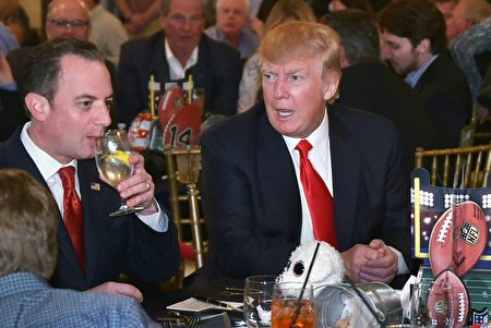 US President Donald Trump chats with White House Chief of Staff Reince Priebus while watching Super Bowl LI at Trump International Golf Club Palm Beach in West Palm Beach, Florida on February 5, 2017. / AFP / MANDEL NGAN (Photo credit should read MANDEL NGAN/AFP/Getty Images)
